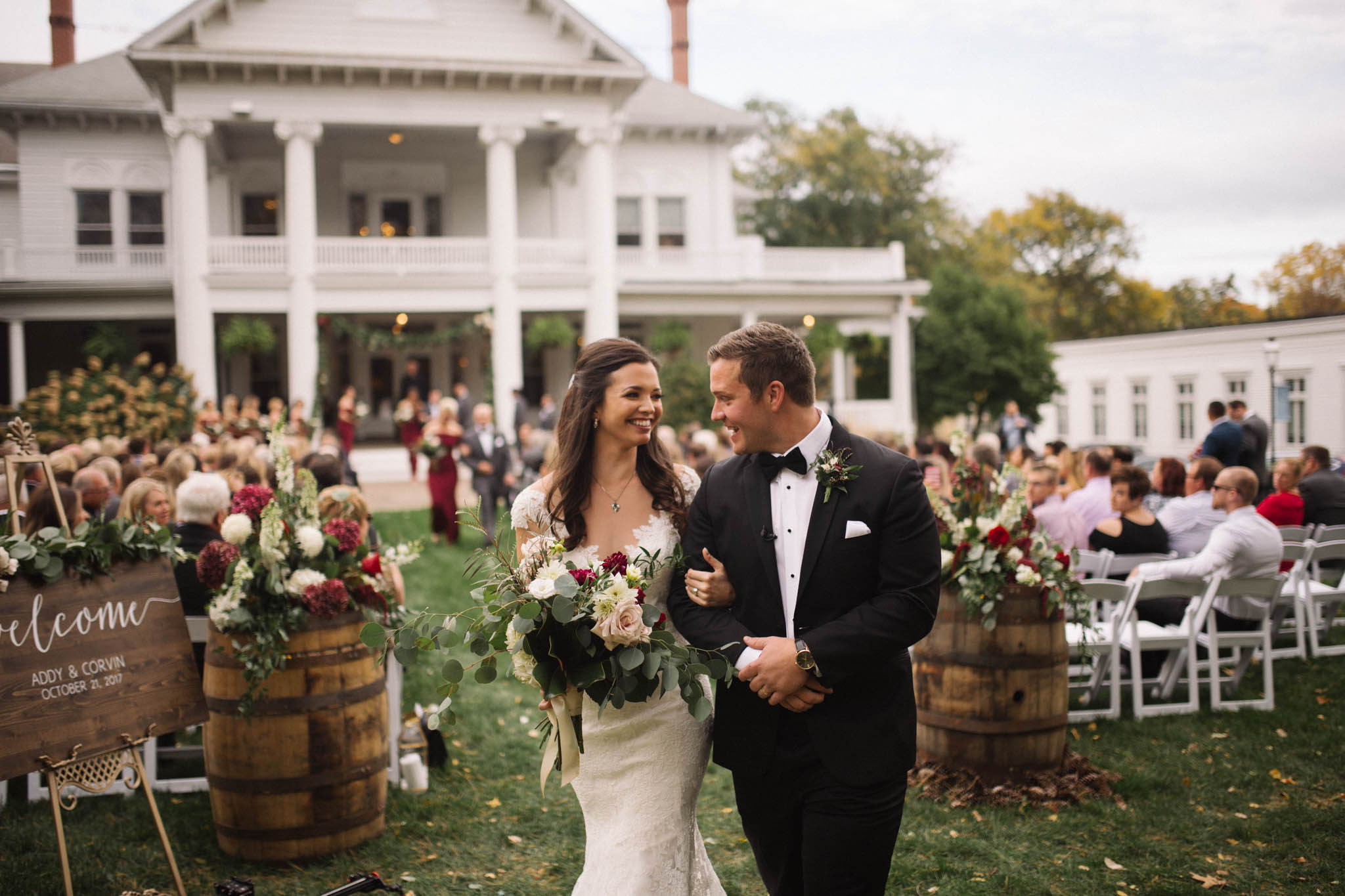 Married couple walking out of ceremony at the Women's Club in Davenport, Iowa