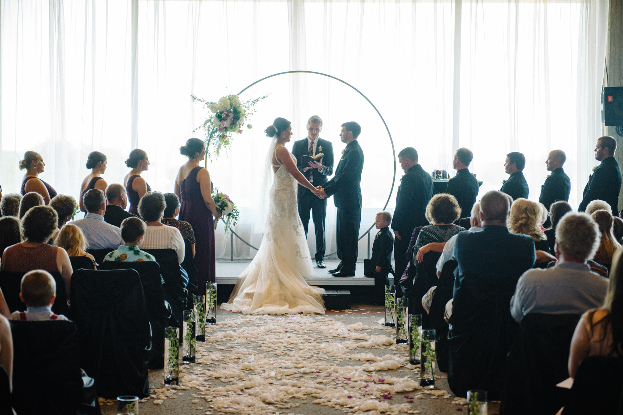 Couple standing at custom made circle alter