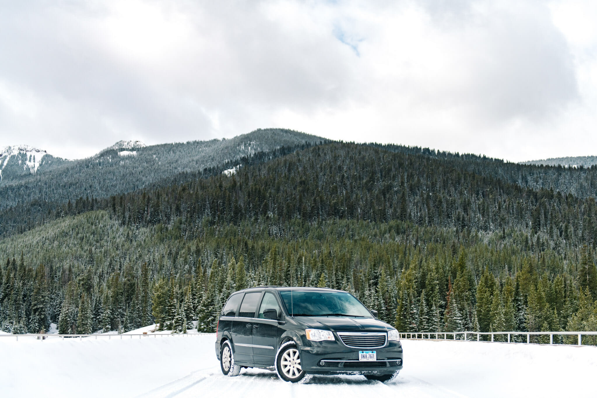 Stunning Chrystler Town & Country beautifully parked in front of mountains