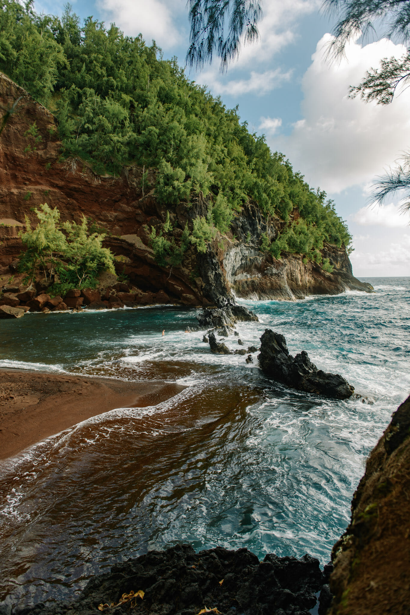 Red sand beach on the road to hana in Hawaii