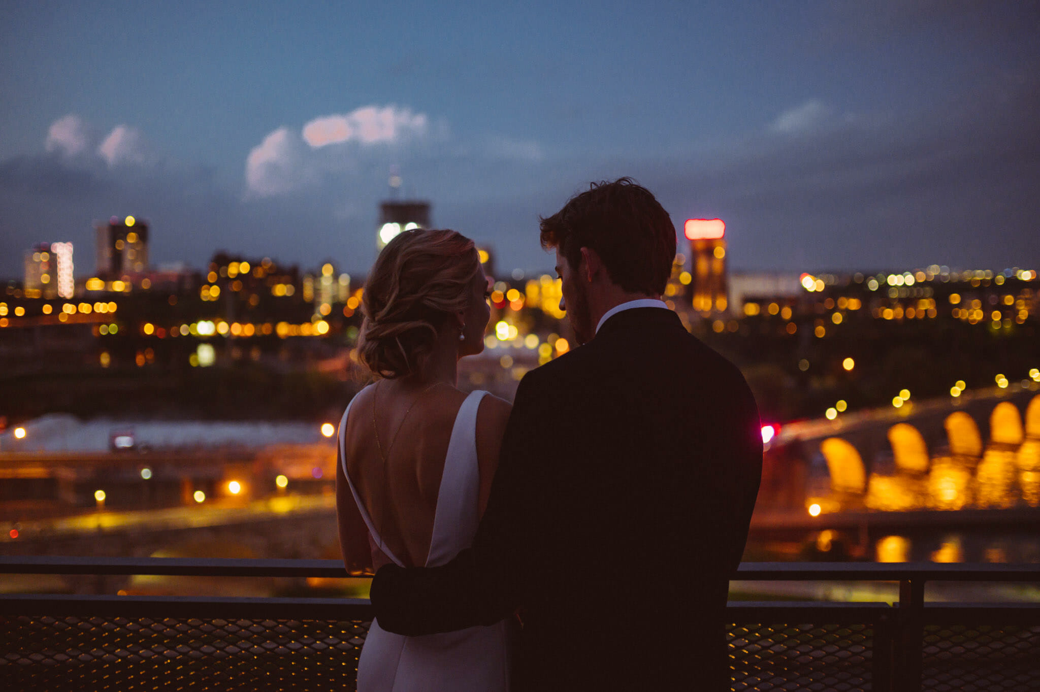 Bride and Groom overlooking downtown Minneapolis after dark