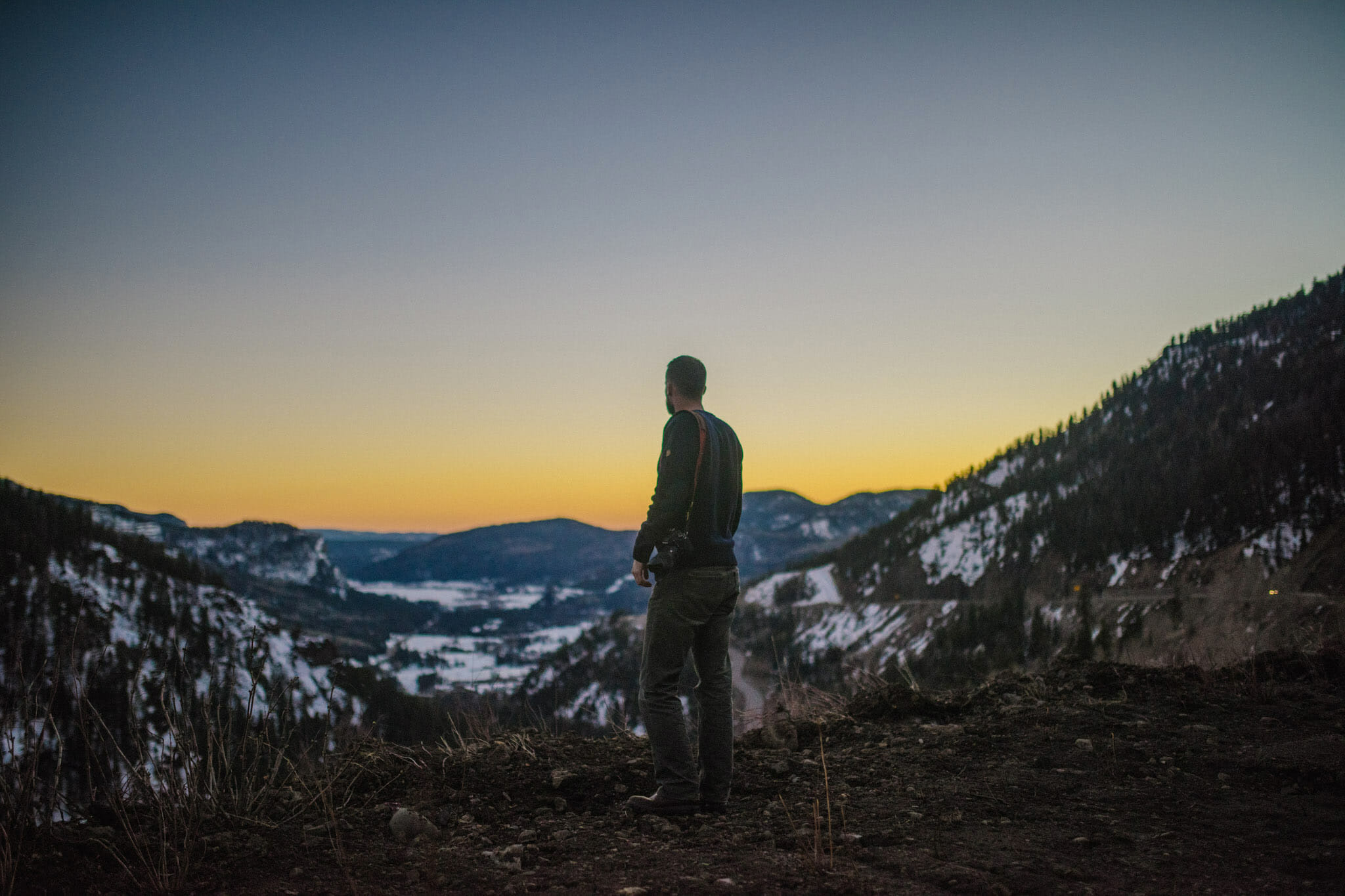 A photo of Austin Day standing overlooking loveland pass